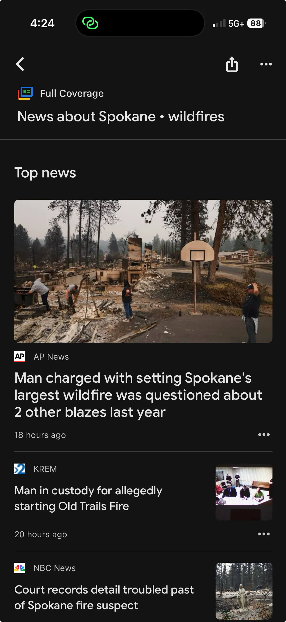 Google News Full Coverage screen grouping reporting from AP News, KREM, NBC News, and other publishers around a Spokane wildfire.
